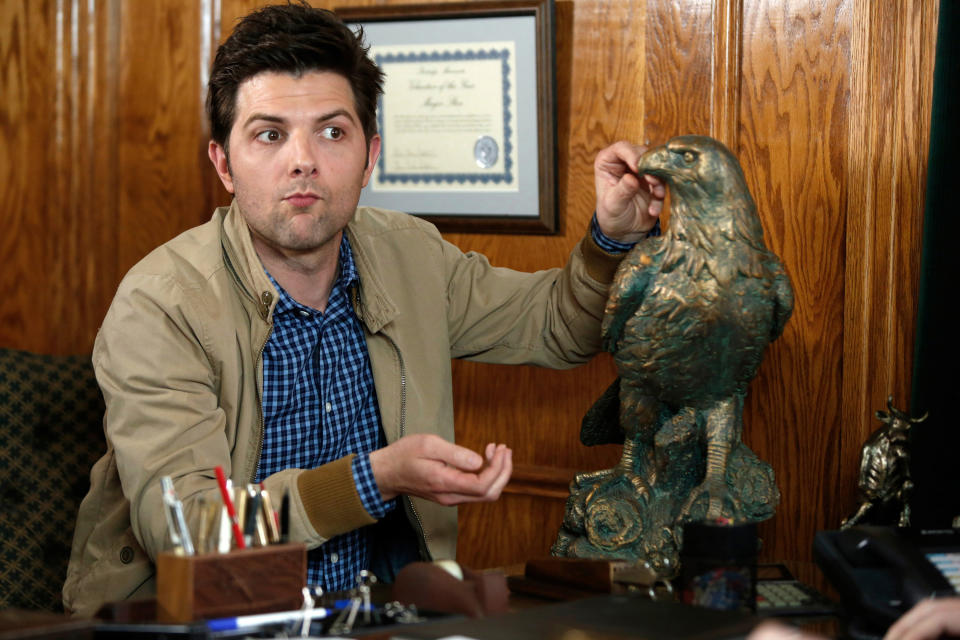 Ben Wyatt sitting at a desk on "Parks and Rec"