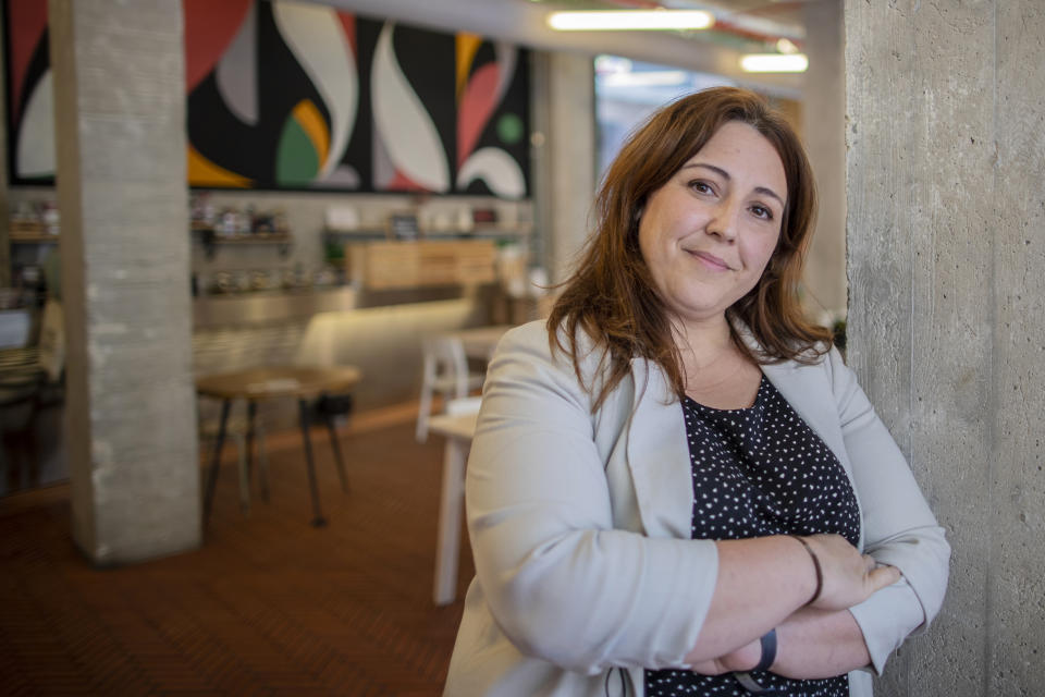 Maria Alvarez co-owner of La Francachela and founder of the Campaña 4 Suma poses for a picture at La Francachela restaurant in Madrid, Spain, Friday, March 26, 2021. Experimenting with cutting back one workday per week is about to go nationwide in Spain. A 3-year pilot project will be using 50 million euros ($59 million) from the European Union's massive coronavirus recovery fund to compensate companies as they resize their workforce or reorganize production workflows to adapt to a 32-hour working week. (AP Photo/Manu Fernandez)