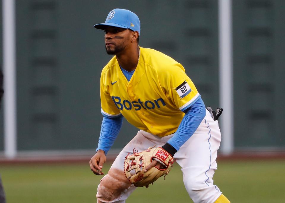 Red Sox shortstop Xander Bogaerts (2) wears the team's City Connect jersey, commemorating the Boston Marathon, against the White Sox at Fenway Park in Boston on April 17, 2021.