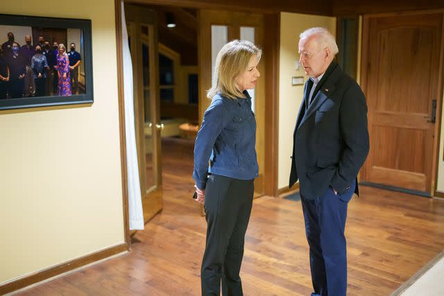 <p>Official White House Photo by Adam Schultz</p> Liz Sherwood-Randall pulls President Joe Biden aside at Camp David on April 16, 2022, to brief him on the Columbiana Centre Mall shooting in South Carolina