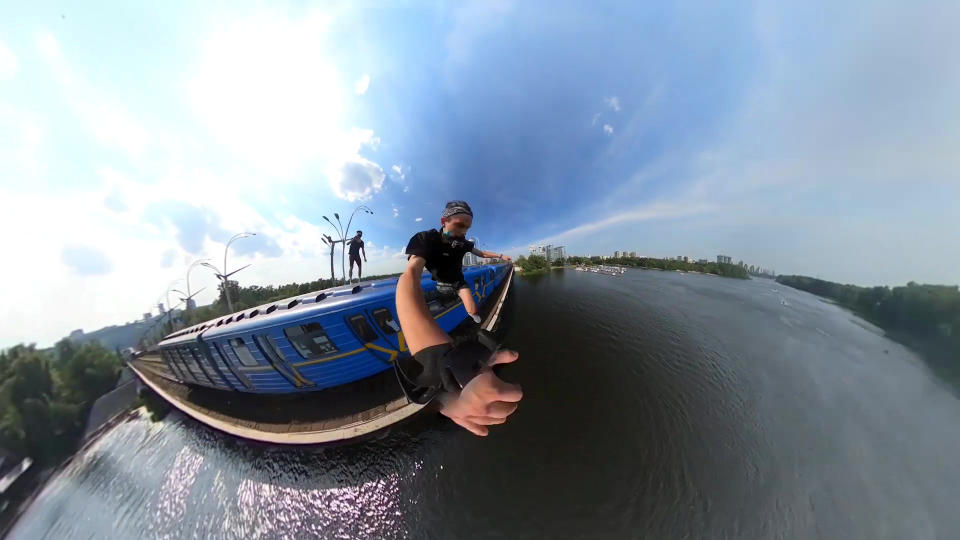 This heart-stopping footage shows a daredevil jumping from a speeding train into a river below. Yaro Panchenko, 18, is seen 'surfing' the subway car as it moves through his home town of Kiev in the Ukraine on August 1 this year. Not content with just surfing the train, Yaro then leaps from the carriage as it crosses a bridge into the water below. However, it didn't go entirely to plan as his Go Pro camera hit him in the face on impact and knocked out a tooth.