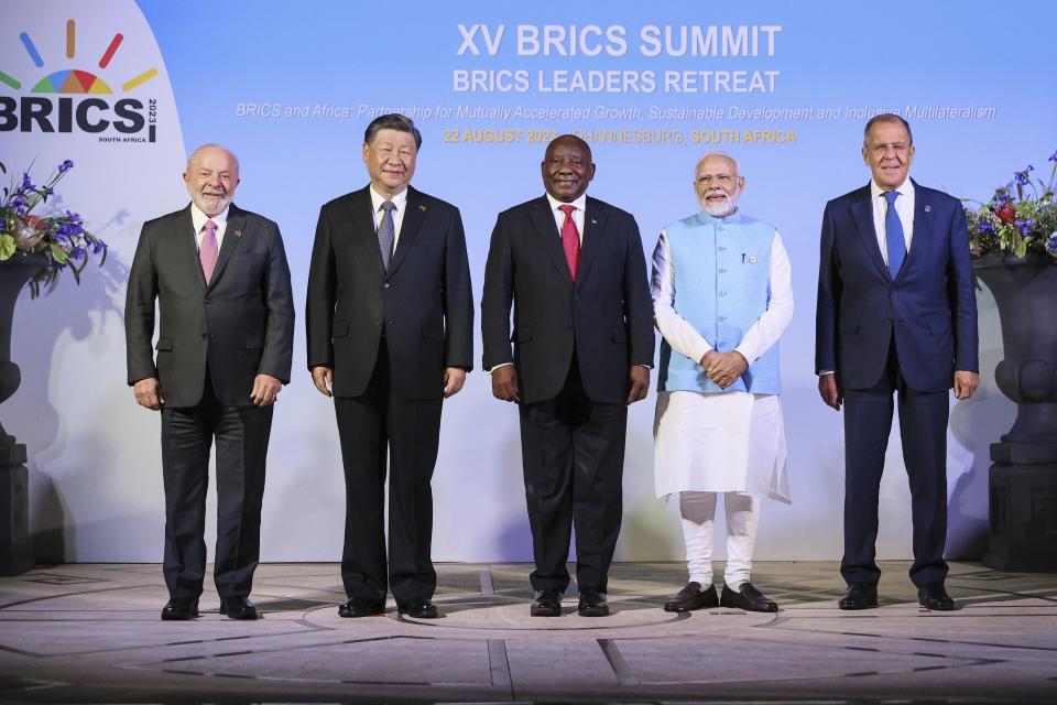 In this photo released by the Russian Foreign Ministry Press Service, Brazilian President Luiz Inacio Lula da Silva, Chinese President Xi Jinping, South African President Cyril Ramaphosa, Indian Prime Minister Narendra Modi and Russian Foreign Minister Sergey Lavrov pose for a photo on the sideline of the BRICS group of emerging economies three-day summit in Johannesburg, South Africa, Tuesday, Aug. 22, 2023. (Russian Foreign Ministry Press Service via AP)