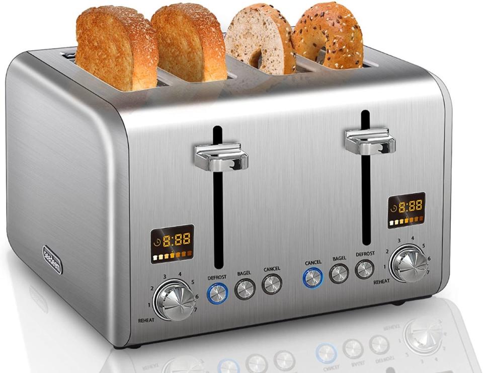 Stainless steel four slice toaster with bread and bagels inside