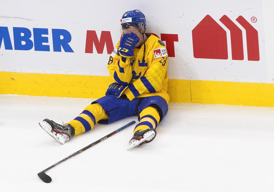 Sweden's Noel Gunler (28) reacts after the loss to Finland after an IIHL World Junior Hockey Championship game, Saturday, Jan. 2, 2021 in Edmonton, Alberta. (Jason Franson/The Canadian Press via AP)