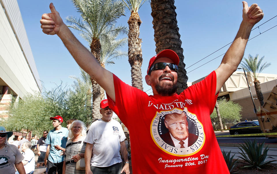 <p>A supporter of U.S. President Donald Trump calls out in support of the president as he waits in line to enter a Trump rally on August 22, 2017 in Phoenix, Arizona. (Ralph Freso/Getty Images) </p>