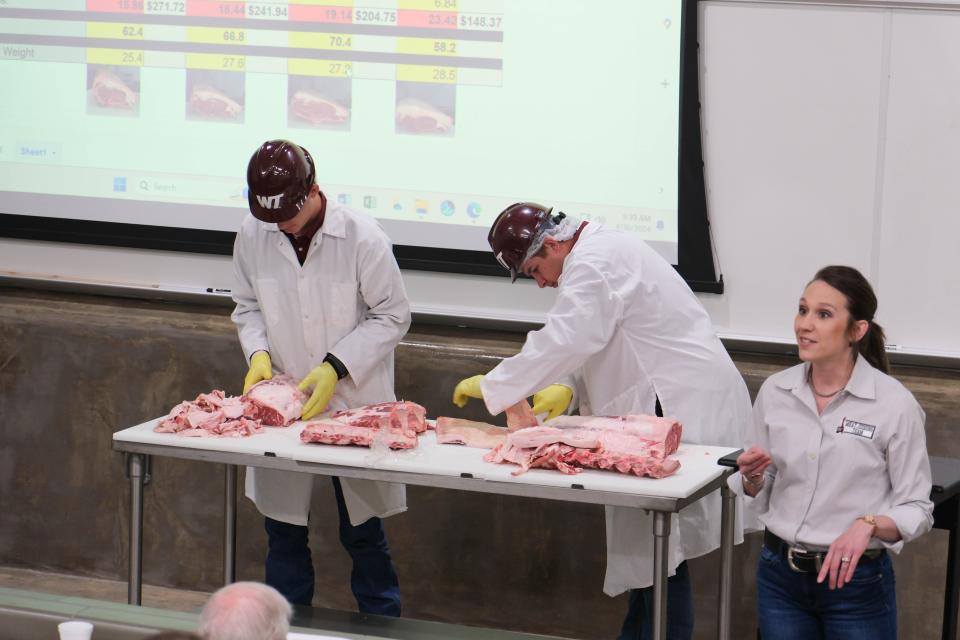 Members of the WT meat judging team demonstrate their expertise Tuesday at a One West Campaign Steering Committee Meeting at West Texas A&M.