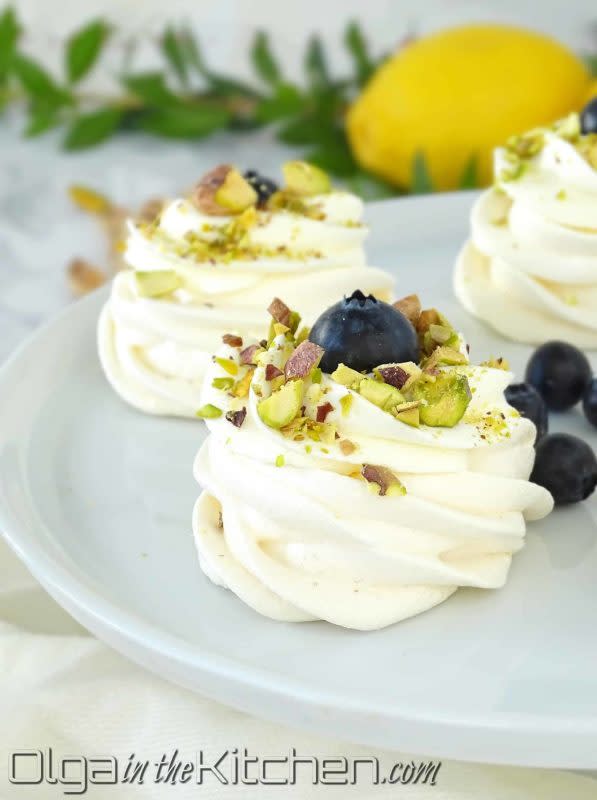 <p>Olga in the Kitchen</p><p>Mini pavlova is a beautiful, delicious, bite-size dessert for any occasion, especially holidays. Crispy on the outside and slightly chewy on the inside, topped with fluffy cream, your favorite fresh berries and nuts.</p><p><strong>Get the recipe: <a href="https://www.olgainthekitchen.com/mini-pavlovas/" rel="nofollow noopener" target="_blank" data-ylk="slk:Mini Pavlovas;elm:context_link;itc:0;sec:content-canvas" class="link ">Mini Pavlovas</a></strong></p>