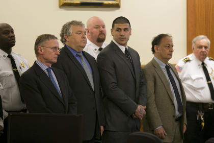 Aaron Hernandez, center, stands as the verdict is read in his murder trial. (AP)