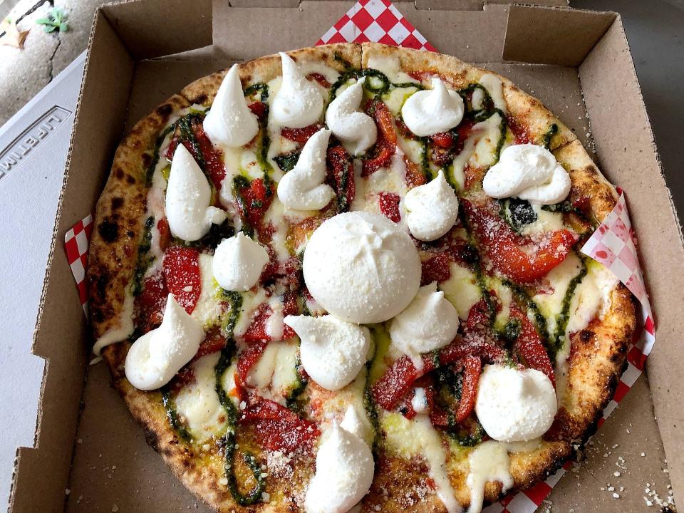 Bianca pizza topped with fresh ricotta and Burrata Bomb from Ippa Pizza is a whole new level of delicious.