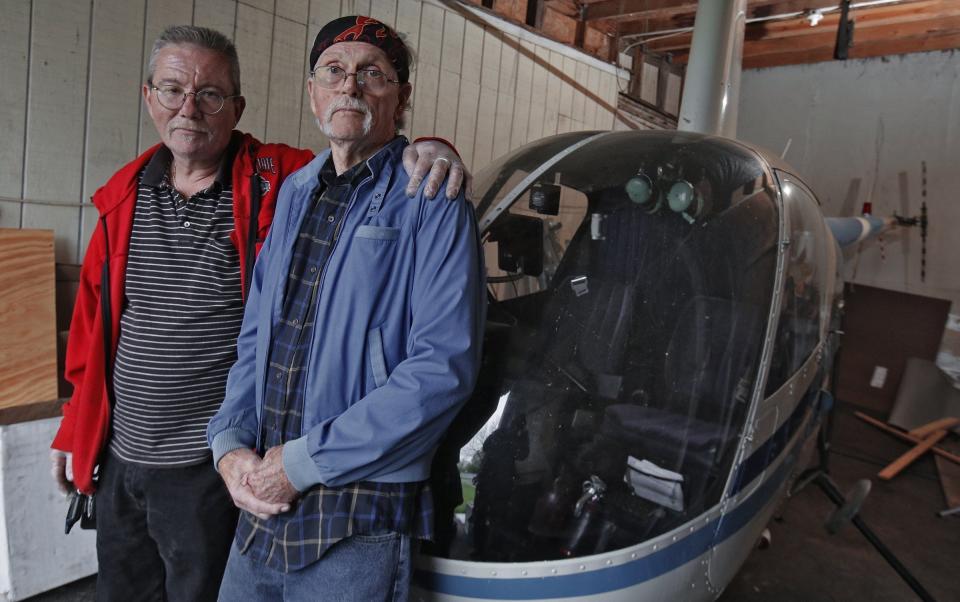 Lowell Newsome, right, with his son, Chris, was looking for a pilot to take him up in his Robinson R22 helicopter. A stroke grounded the elder Newsome, meaning the two-seater copter had been sitting in his garage for two years when Dispatch metro columnist Theodore Decker met them in 2017.