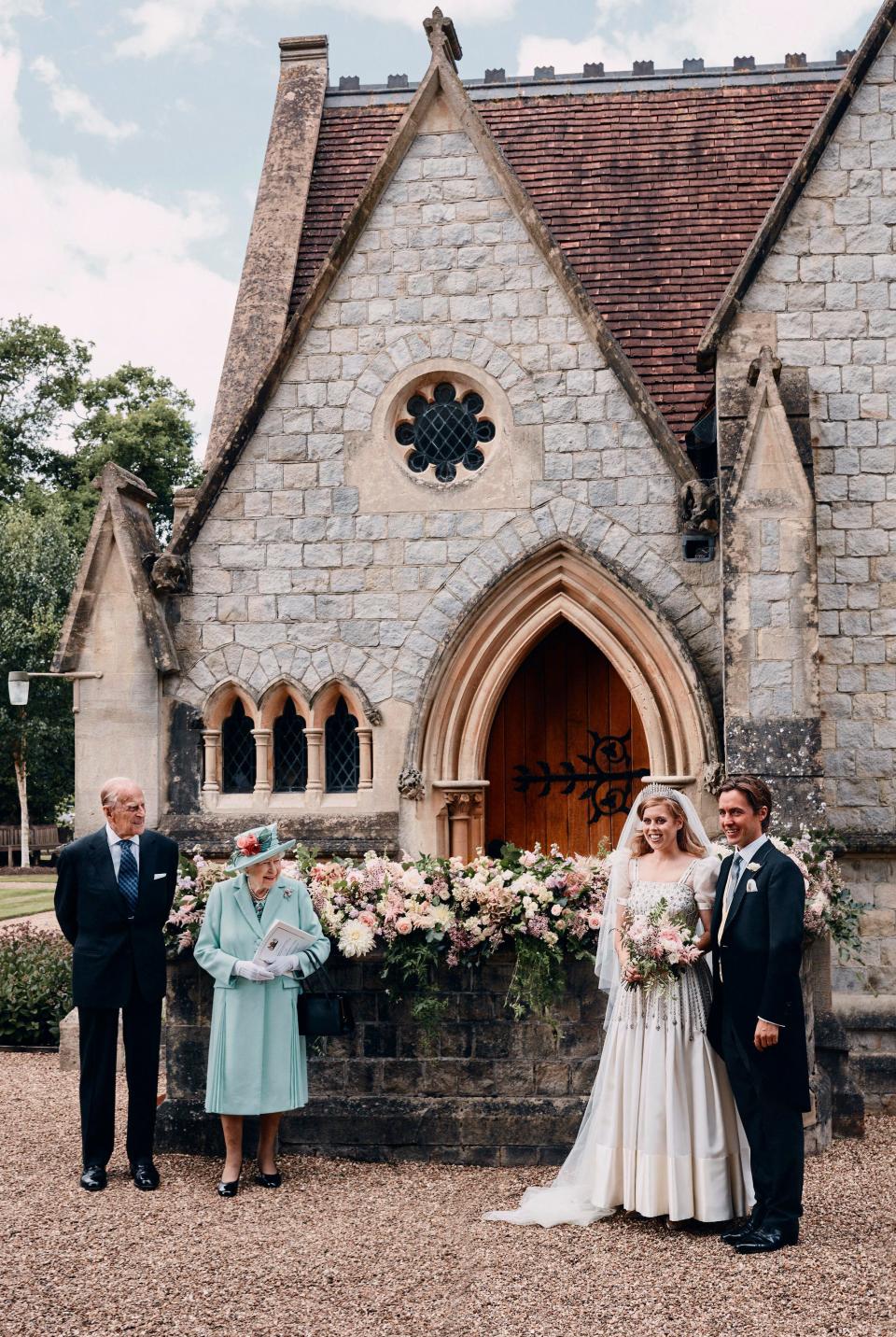 Queen Elizabeth II and Prince Philip with Princess Beatrice and Edoardo Mapelli Mozzi outside The Royal Chapel of All Saints at Windsor, after their wedding on July 17, 2020.