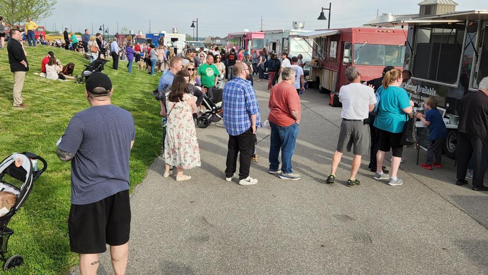 Crowds gather for the first Food Trucks at Friedman event on Thursday, Apr. 28, 2022. The food truck gathering will continue on Thursday evenings throughout the summer.