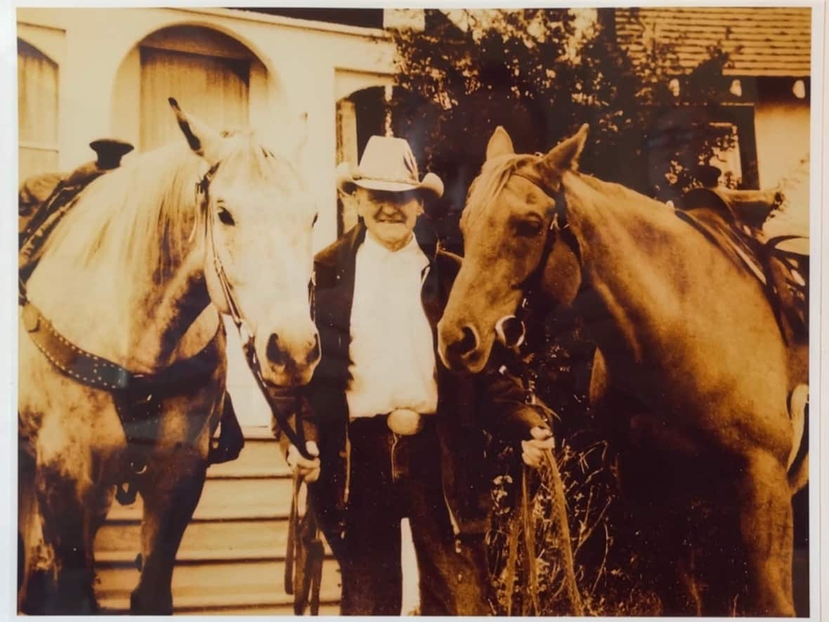 The first president of Saddle Ridge Community Association, Hugh Bennett, with two of his horses. (Dan McGarvey/CBC - image credit)