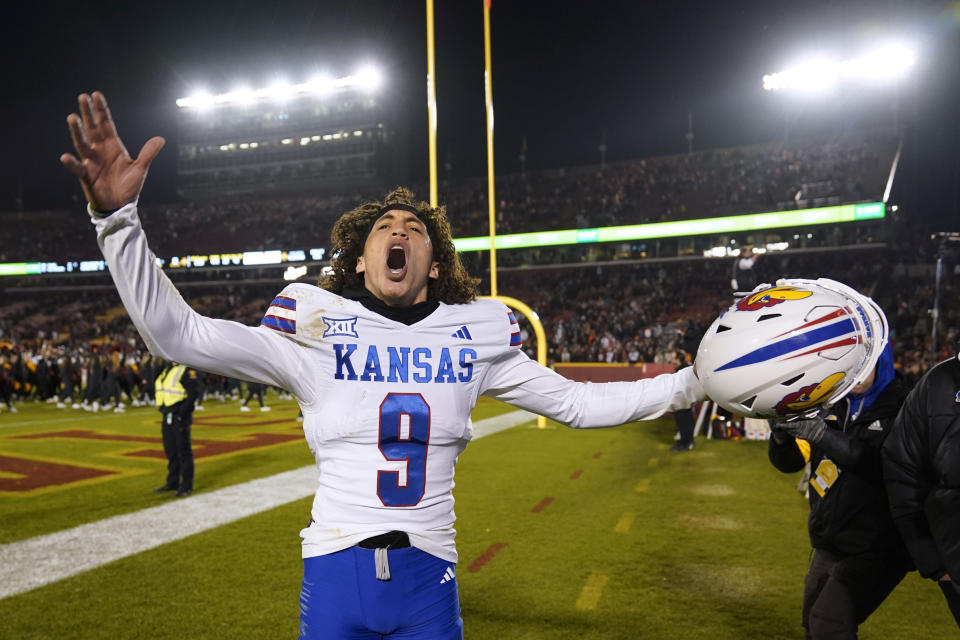 Kansas quarterback Jason Bean celebrates after an NCAA college football game against Iowa State, Saturday, Nov. 4, 2023, in Ames, Iowa. Kansas won 28-21. (AP Photo/Charlie Neibergall)