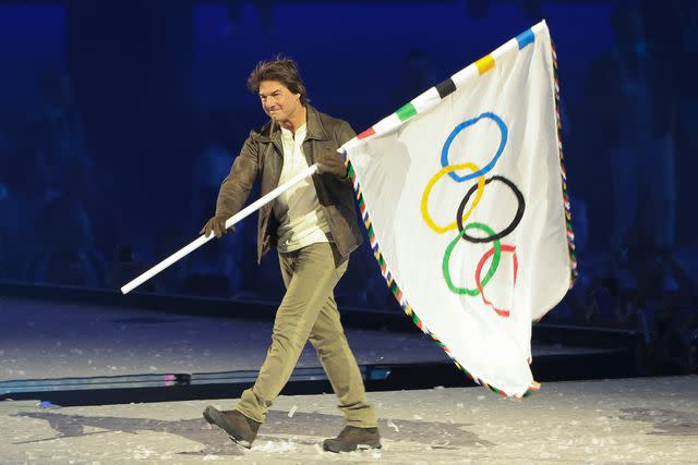 <p>Jean Catuffe/Getty</p> Tom Cruise at the 2024 Olympics closing ceremony