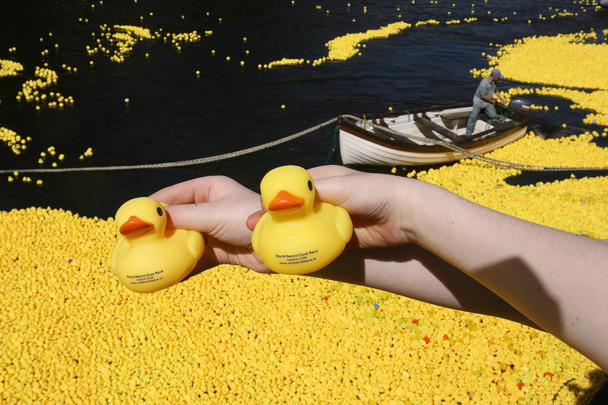 150,000 plastic ducks are launched at the Millennium Bridge in Dublin, to race towards the Sean O'Casey bridge - the first Irish attempt to enter the Guinness Book of Records for the world's largest plastic duck race. / Credit: Julien Behal - PA Images/PA Images via Getty Images