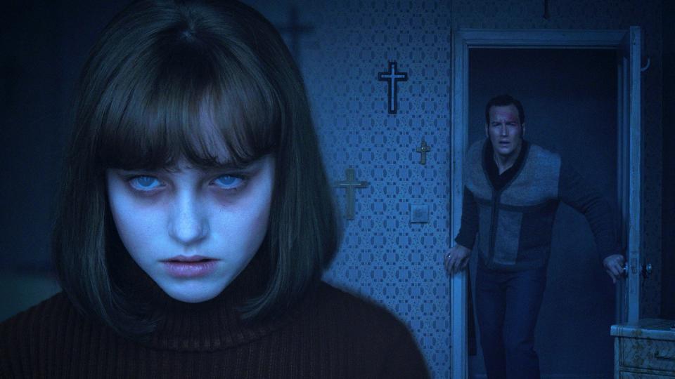 Ed Warren (Patrick Wilson, right) tries to helped the possessed Janet (Madison Wolfe) in "The Conjuring 2."