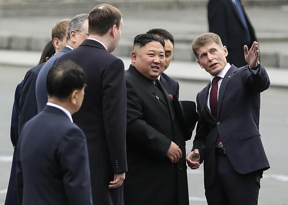 In this photo released by press office of the administration of Primorsky Krai region, North Korea's leader Kim Jong Un, second right, speaks with the governor of the far eastern region of Primorsky Krai Oleg Kozhemyako after arriving in Vladivostok, Russia, Wednesday, April 24, 2019. North Korean leader Kim Jong Un arrived in Russia on Wednesday morning for his much-anticipated summit with Russian President Vladimir Putin in the Pacific port city of Vladivostok. (Igor Novikov/Press Office of the Primorye Territory Administration via AP)