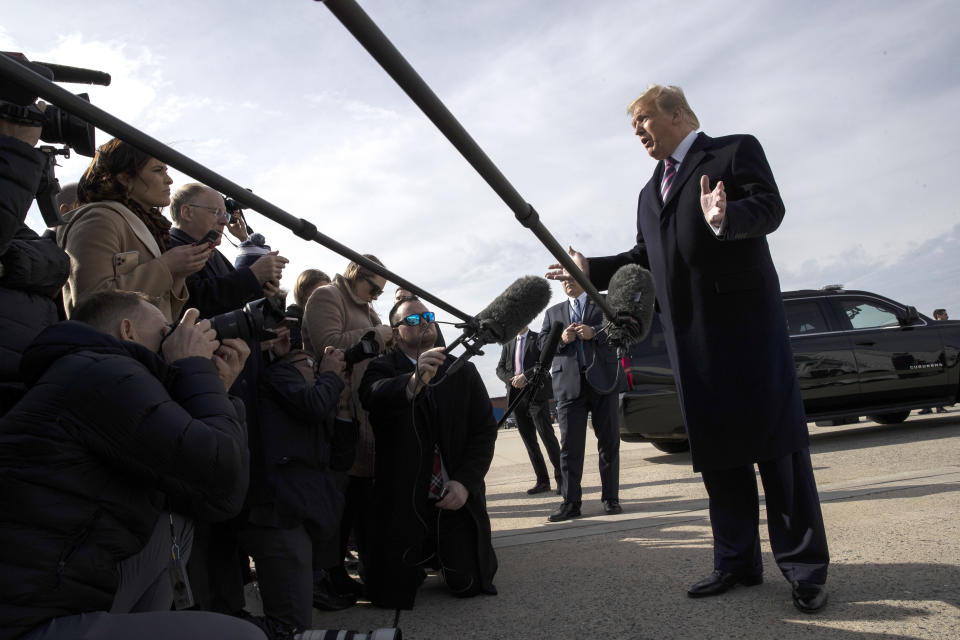 President Donald Trump speaks with reporters as he boards Air Force One as he departs Tuesday, Feb. 18, 2020, at Andrews Air Force Base, Md.(AP Photo/Alex Brandon)