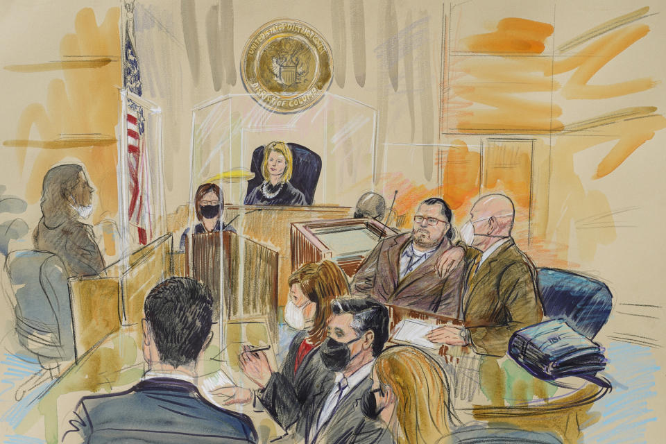 This artist sketch depicts Judge Dabney Friedrich looking out from the bench during jury selection for Guy Wesley Reffitt, joined by his lawyer William Welch, top right, in Federal Court, in Washington, Monday, Feb. 28, 2022. Seated from front left are members of the U.S. prosecution legal team, Tim Ryan, Risa Berkower, Jeff Nestler, and Amanda Rohde. Reffitt, a Texas man charged with storming the U.S. Capitol with a holstered handgun on his waist, is the first Jan. 6 defendant to go on trial. (Dana Verkouteren via AP)