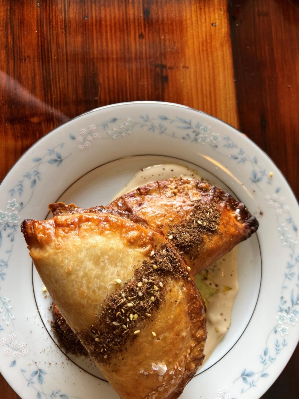 The hand pies come with chickpea shakshuka at Ciderhouse Restaurant at Wilson's Orchard in Cumming.