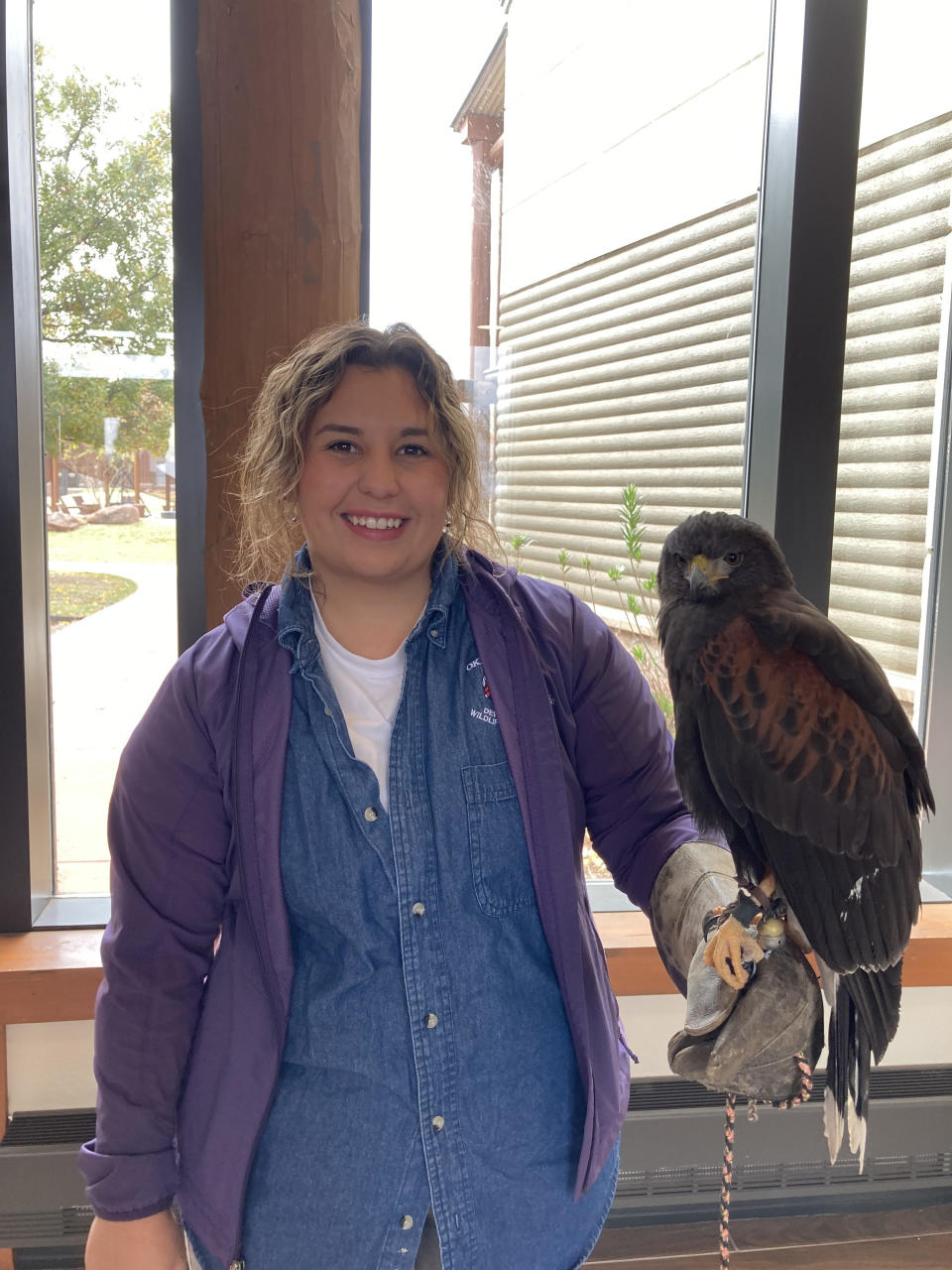 Sarah Southerland poses with a large bird