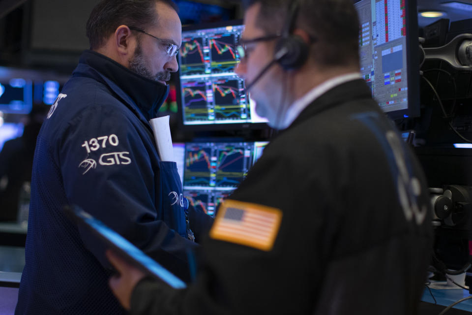 NEW YORK, NY - JANUARY 10: Traders work on the floor of the New York Stock Exchange (NYSE) on January 10, 2020 in New York City. Amid new sanctions on Iran and 145k more U.S. jobs added and wage growth in December, the Dow topped the 29,000 milestone before pulling back to 28,823.77. (Photo by Kena Betancur/Getty Images)