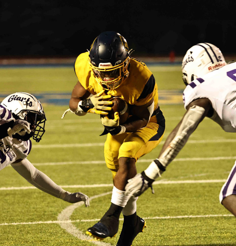 Moeller running back Jordan Marshall runs the ball during the Crusaders' football game against Indianapolis Ben Davis Friday, Aug. 18, 2023.