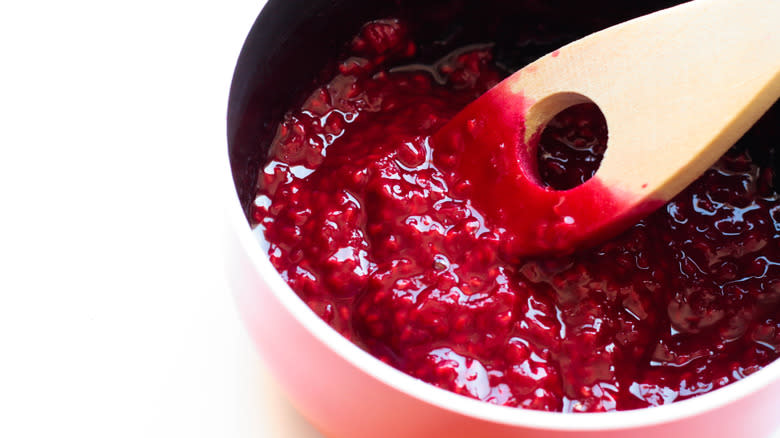 making raspberry sauce in pan