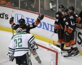 Anaheim Ducks' Kyle Palmieri (21) celebrates his goal with Nick Bonino (13), Francois Beauchemin (23) and Daniel Winnik (34) near Dallas Stars goalie Kari Lehtonen(32), of Finland, during the first period in Game 1 of the first-round NHL hockey Stanley Cup playoff series on Wednesday, April 16, 2014, in Anaheim, Calif. (AP Photo/Jae C. Hong)