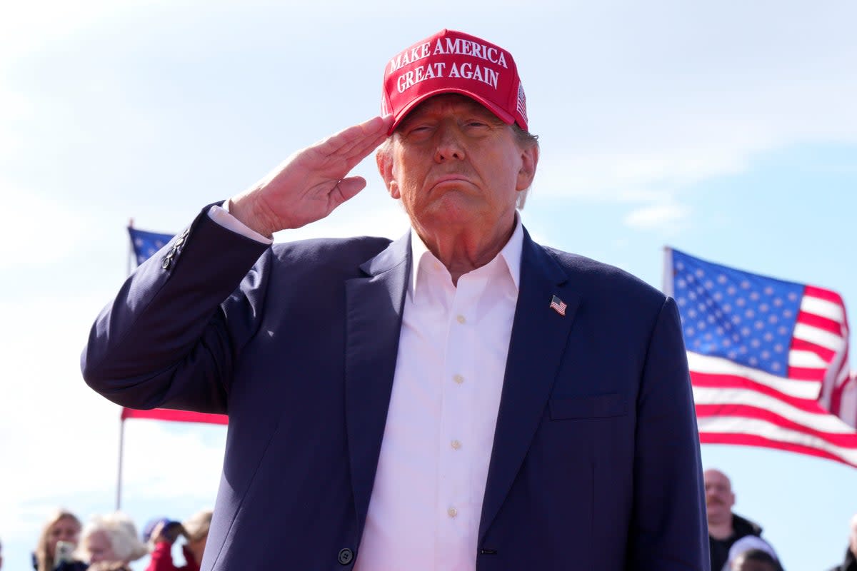 Republican presidential candidate former President Donald Trump salutes at a campaign rally Saturday, March 16, 2024, (AP)