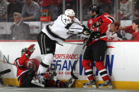 NEWARK, NJ - JUNE 02: Dwight King #74 of the Los Angeles Kings makes contact with Peter Harrold #10 of the New Jersey Devils during Game Two of the 2012 NHL Stanley Cup Final at the Prudential Center on June 2, 2012 in Newark, New Jersey. (Photo by Bruce Bennett/Getty Images)