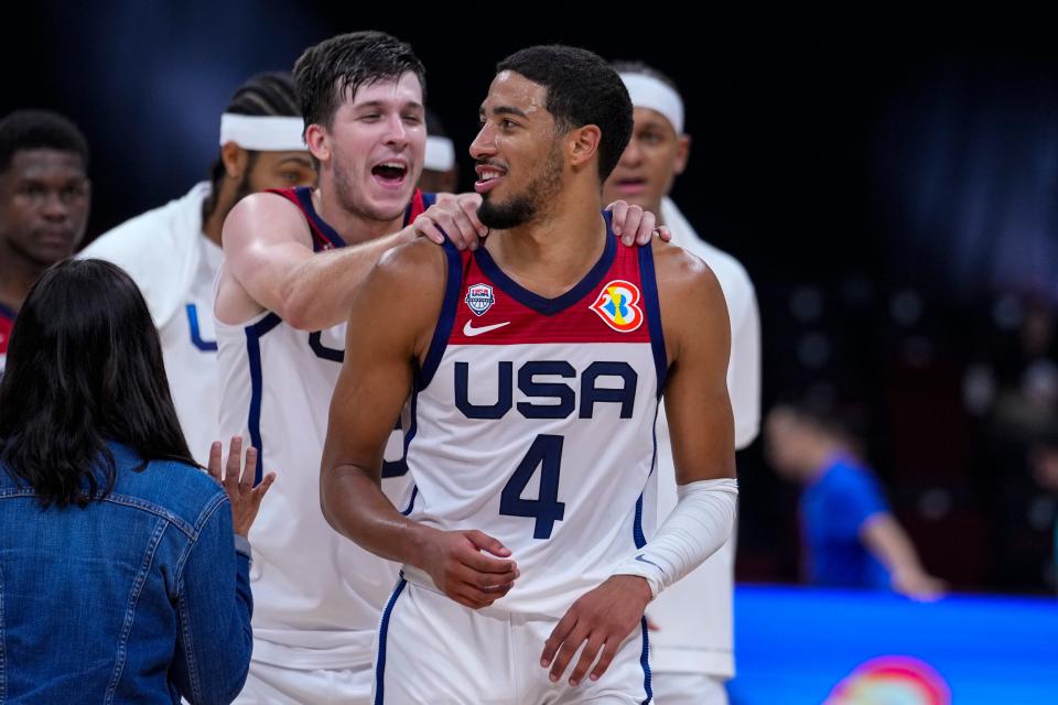 Austin Reaves comes from behind to congratulate Tyrese Haliburton during the second half.