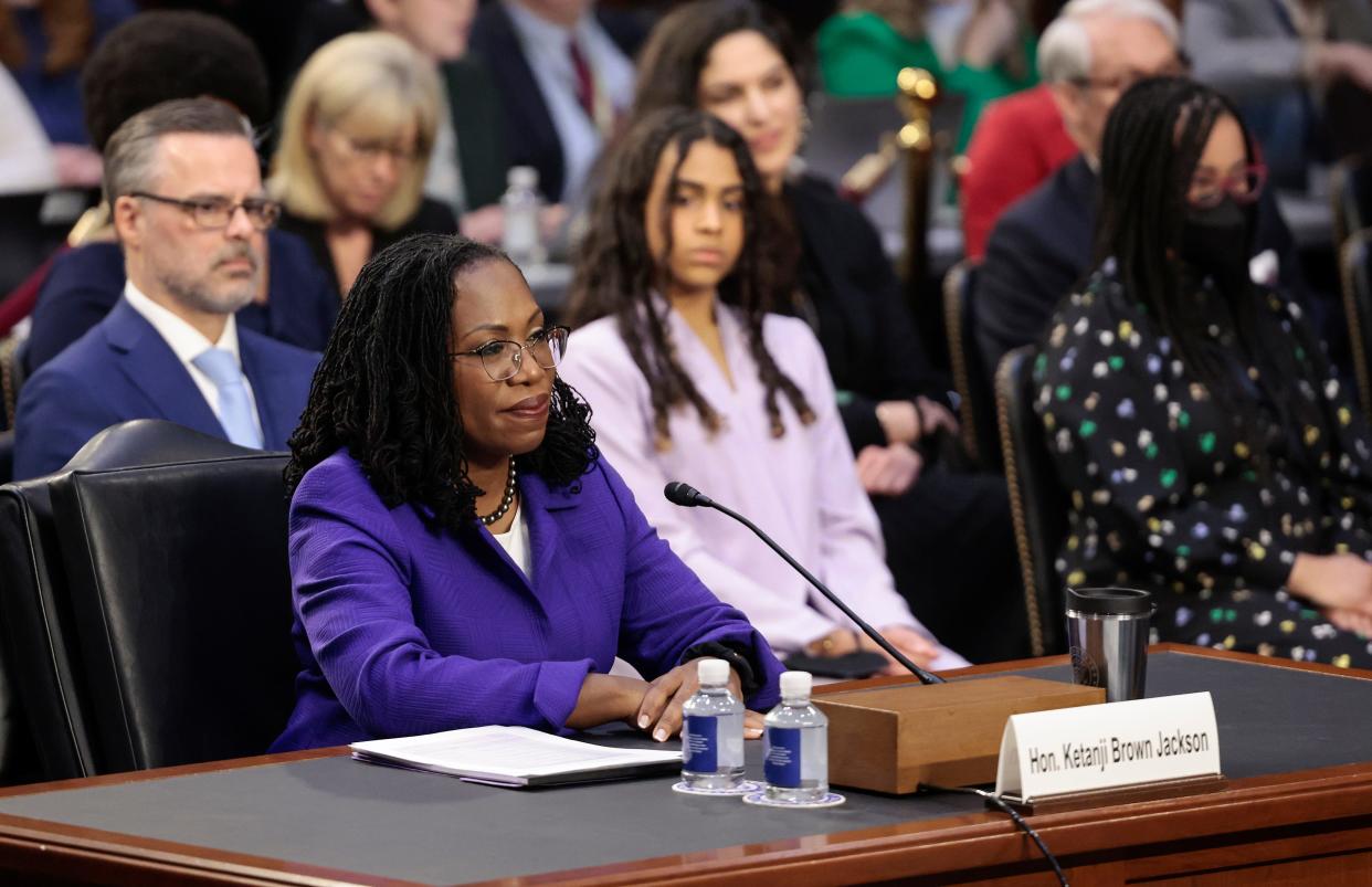 Judge Ketanji Brown Jackson has family support at her Supreme Court confirmation hearing March 21. Behind her, from left, is husband Patrick Jackson and daughters Leila and Talia.