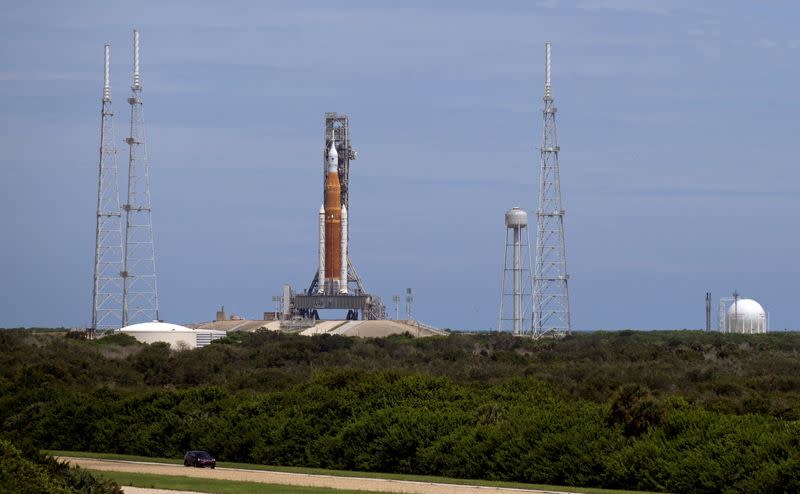 NASA's Space Launch System (SLS), with the Orion crew capsule perched on top, stands on launch pad 39B one day after an engine-cooling problem forced NASA to delay the debut test launch