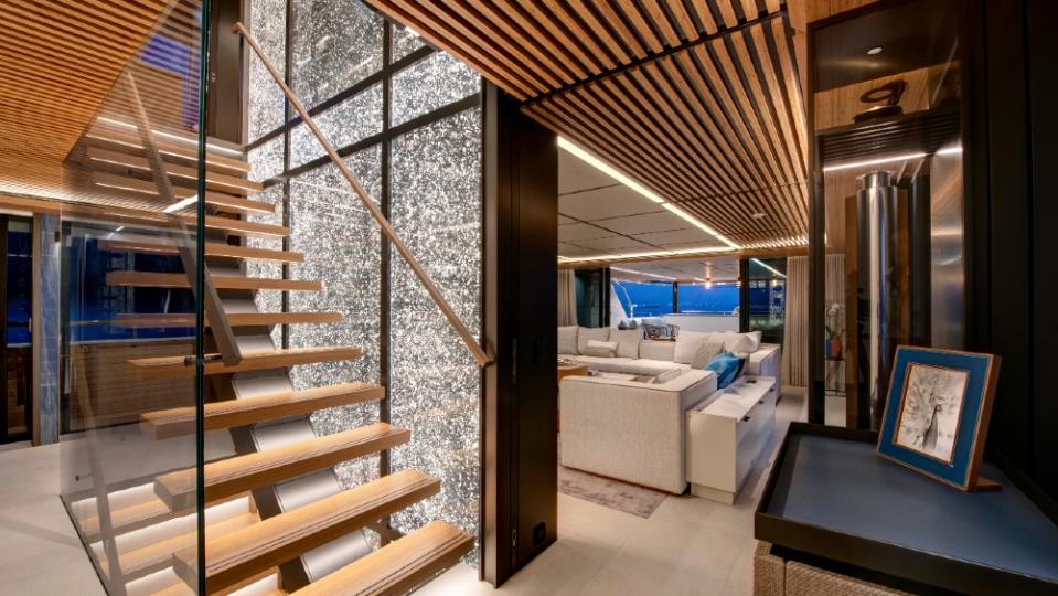 Combining details like the bamboo ceiling and open staircase kept the interior warm but contemporary. - Credit: Courtesy Pozitif Studio