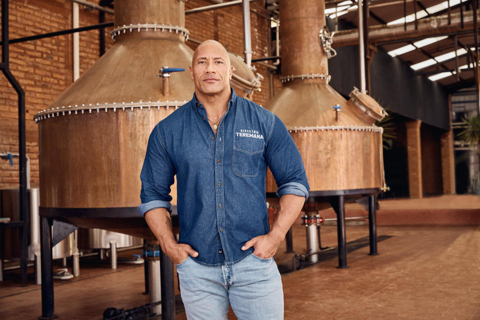 This photo provided by Jesus Maria shows Dwayne Johnson, co-founder of Teremana Tequila at the Teremana tequila distillery in Jalisco, Mexico. Johnson joins a list of celebrities including George Clooney, Nick Jonas and Kendall Jenner with their own tequila brands. (Jesus Maria via AP)