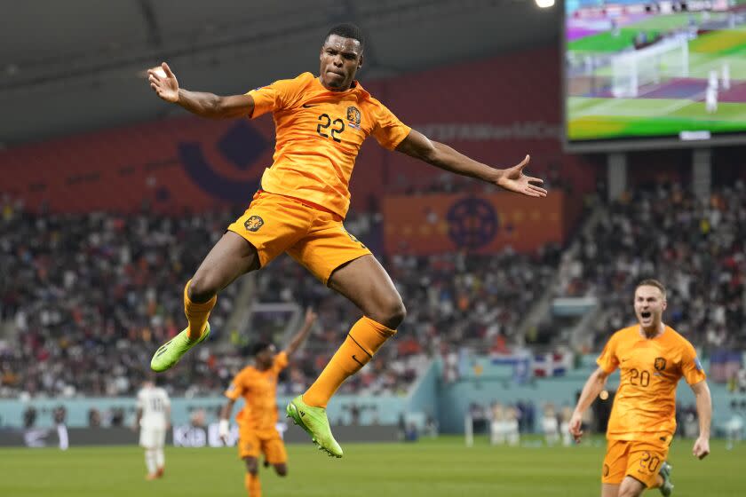 Denzel Dumfries of the Netherlands celebrates scoring his side's 3rd goal during the World Cup.