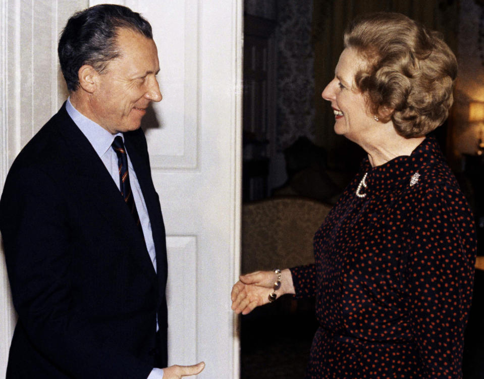 FILE - In this Oct. 15, 1984 file photo, Britain's Prime Minister Margaret Thatcher greets France's Jacques Delors, the then president-elect of the European Commission, inside 10 Downing Street, London. Thatcher's 11-year premiership became increasingly dominated by her opposition to what later became known as the European Union, in particular Delors' plan to create a European single currency. On Jan. 31, 2020, Britain is scheduled to leave the EU after 47 years. (Pool Photo via AP, File)