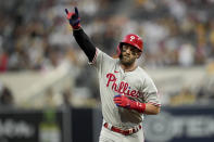 Philadelphia Phillies' Bryce Harper celebrates after a home run during the fourth inning in Game 1 of the baseball NL Championship Series between the San Diego Padres and the Philadelphia Phillies on Tuesday, Oct. 18, 2022, in San Diego. (AP Photo/Gregory Bull)