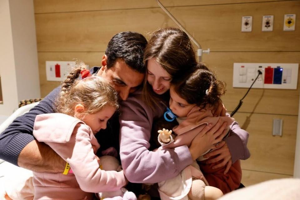 Israeli father Yoni is reunited with his two daughters, Aviv and Raz, and his wife Doron after they were returned from Gaza (Schneider Children's Medical Center Spokesperson. The photos and video are at the request and with the permission of the family.)