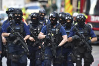 <p>Armed police patrol St. Thomas Street in London, Sunday, June 4, 2017. Police specialists collected evidence in the heart of London after a series of attacks described as terrorism killed several people and injured more than 40 others. (Photo: Dominic Lipinski/PA via AP) </p>