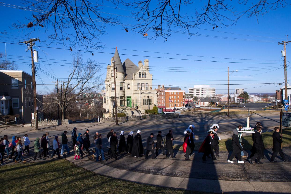 Cincinnati's Catholic Archbishop, Dennis Schnurr, leads a procession from Planned Parenthood to Holy Name Church in 2015. Schnurr and his fellow Ohio bishops now are involved in the campaign against Issue 1, which would guarantee the right to an abortion if voters approve it Nov. 7.