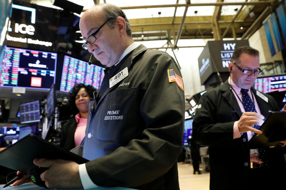 Traders work on the floor at the New York Stock Exchange (NYSE) in New York, U.S., November 18, 2019. REUTERS/Brendan McDermid