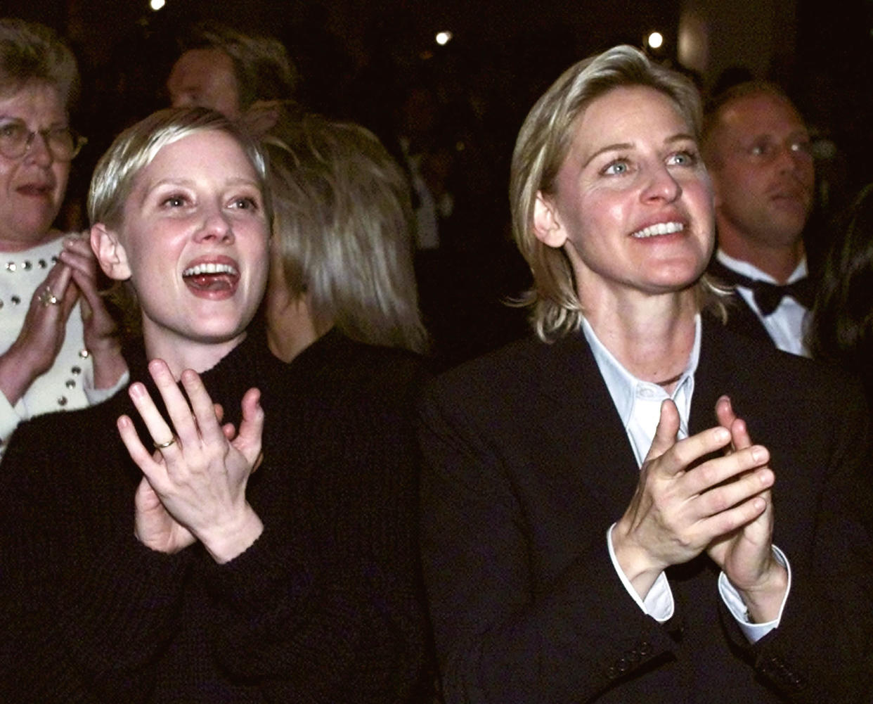 Actresses Anne Heche (L) and Ellen Degeneres applaud after U.S. President Bill Clinton makes remarks in Los Angeles, October 2, 1999. The president was attending an Access Now For Gay and Lesbian Equality fundraiser.
**DIGITAL IMAGE**