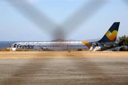 A Condor airlines plane, part of the Thomas Cook Group, is seen at the Heraklion airport on the island of Crete