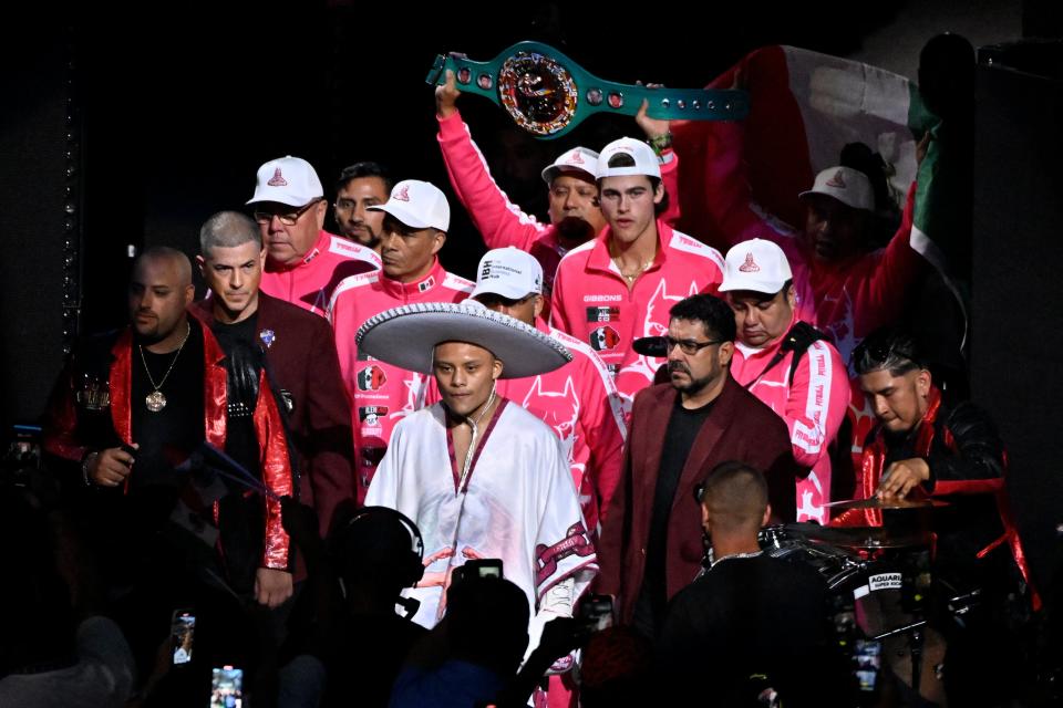 Isaac Cruz enters the ring prior to his lightweight boxing match against Giovanni Cabrera (AP)