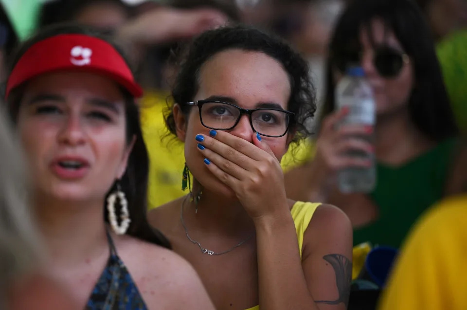 A fan of Brazil reacts while watching the live broadcast of the Qatar 2022 World Cup Quarter-final round football match between Brazil and Croatia in Rio de Janeiro, Brazil, on December 9, 2022. (Photo by CARL DE SOUZA / AFP) (Photo by CARL DE SOUZA/AFP via Getty Images)