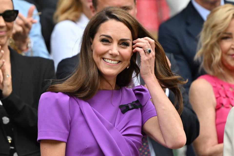 Princess Kate smiles as she arrives in the Royal Box for the men's singles final tennis match at the 2024 Wimbledon Championships in London on July 14, 2024.