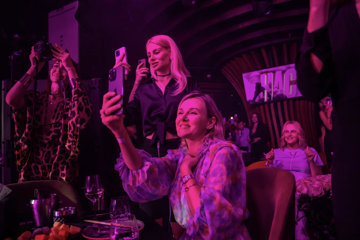 Fans watch as Bi-2, one of Russia’s most popular rock bands, performs at Chalet Berezka, a Russian restaurant and nightclub in Dubai, United Arab Emirates on March 1, 2023. (Andrea DiCenzo/The New York Times)